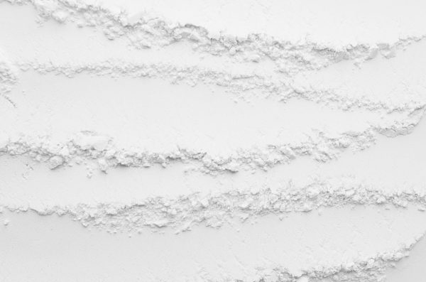 White abstract striped powder texture with horizontal waves.