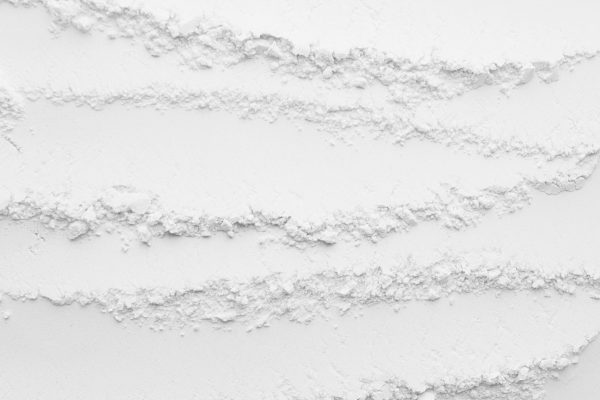 White abstract striped powder texture with horizontal waves.